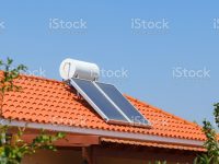 Solar water heating panel and water collector on a house roof